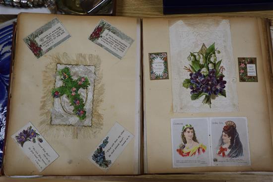 A photograph album and an album of 19th century and later greetings cards and postcards